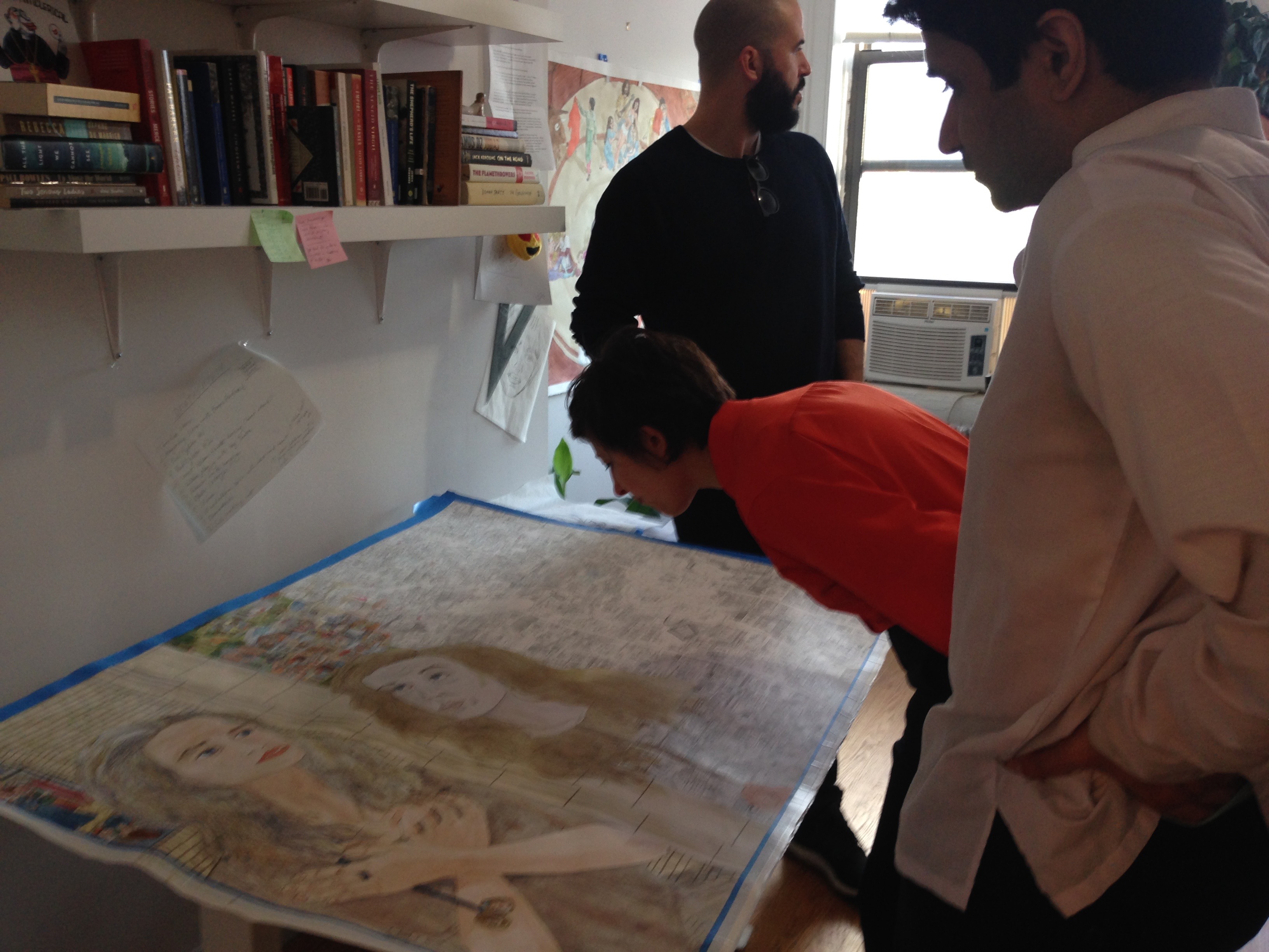 Open Sessions artists examining Jennifer Reiland's drawing. Front to back: Mustafa Faruki, Slinko, Daniel Bejar
